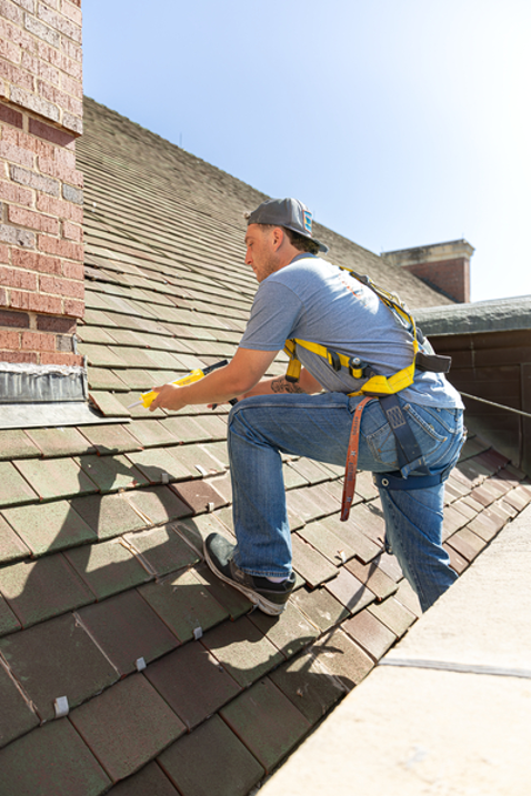 o&m-roof-worker O&M Roof Work